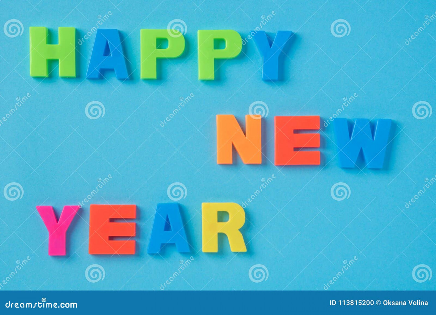 Happy New Year Text with Plastic Letters on a Paper Background